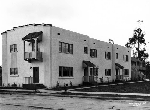 Two Story Apartments with Monterey Colonial style building in rear