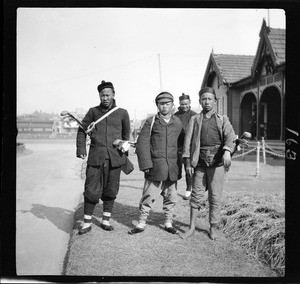 Portrait of caddies at a golf course in China, ca.1900