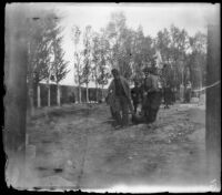 Armenian massacre victim being carried to the mass grave in the Armenian Gregorian Cemetery, Erzurum, Turkey, 1895