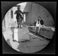 Thomas Allen poses on his bicycle on a block of marble at the Propylaea, Athens, 1891