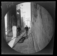 William Sachtleben and Thomas Allen riding bicycles within the north colonnade of the Parthenon, Athens, 1891