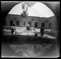 Thomas Allen and William Sachtleben viewing a badger at the zoo of the Prince of Persia, Tabrīz, Iran, 1891