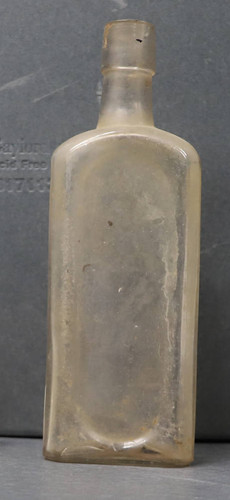 Clear glass, rectangular medicine bottle