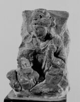 Bas-relief fragment depicting a seated male figure