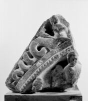 Bas-relief fragment of the upper part of a false gable with a monk and ...