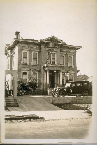 The old home of Governor and later Senator Geo. C. Perkins moved from the north half of the block between Adeline, Chestnut, 8th and 10th Sts. to the West side of Chestnut between 8th and 10th St. Oakland. Photo taken Oct. 5/28
