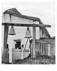 Two bells in front of the Mission San Juan Bautista, photographed by Edward Vischer, before 1875