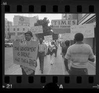 African Americans with placards, picketing Small Business Administration offices in Los Angeles, Calif., 1972