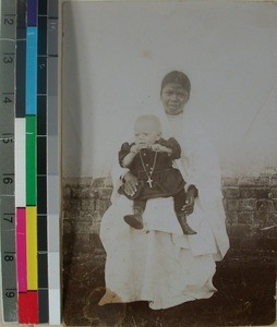 Razafy with a missionary child on her lap, Antsirabe, Madagascar, ca.1905