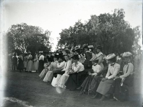 Spectators on the sidelines of a game between Pomona College class of 1901 and class of 1904