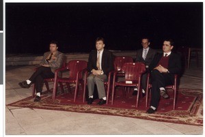 Mihael Kuzmič and three people sitting