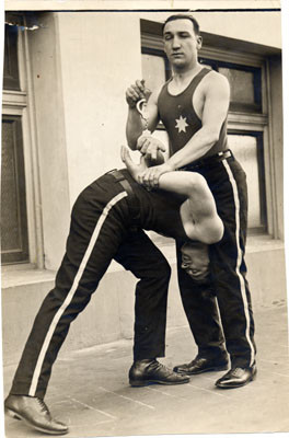 [Officers Frank Mascarelli and Jack O'Keefe demonstrating how to arrest a suspect]