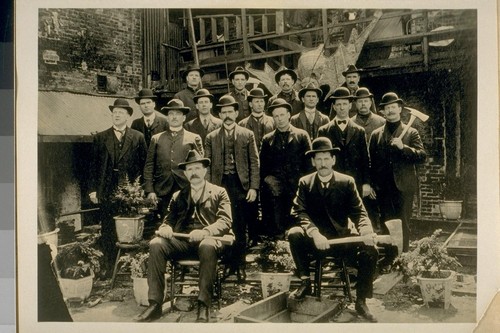 China Town Squad, San Francisco from July to Dec. 1905. Back Row, left to right: 1. T. O'Connell, Police Officer, 2. Fred. Krack, Police Officer, 3. H. Bolton, Police Officer, 4. Ed. Casey, Police Officer. 2nd Row, left to right: 1. Collins, now a Lieut. of Police, 2. Ed. Foley, Police Officer, 3. O. Burg, Police Officer, 4. R. Curtin, Police Officer, 5. T. Hanley, Police Officer. 3rd Row, left to right: 1., 2. T. Curtis, Police Officer, 3. T. Conley, Police Officer, 4. Cliff Fields, now a Lieut. of Police, 5. Dan Cronin, now a Lieut. of Police. 6. Front row, left to right: Sergt. Wm Ross, Corpl. Wm Ferguson. From Jesse B. Cook