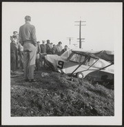 Spectactors look at a downed airplane in Sonora