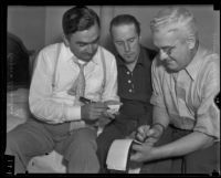 Dr. Ralph Wagner discussing extortion threats with Sheriff Eugene Biscailuz and Joseph E. P. Dunn, Santa Clarita, 1935