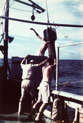 Roger Revelle, James Snodgrass, and Arthur Maxwell on deck of R/V HORIZON recover the temperature gradient recorder that measures geothermal gradients in the sea floor