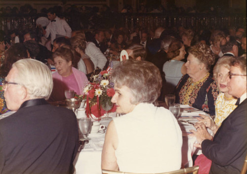 Far side of the table: Dr. Harriett Randall in pink, Mrs. Pepperdine (R), Dorothy Battersea, George Hill