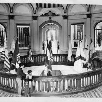 Interior view of the second floor rotunda in the California State Capitol building showing the ten flags that have been planted on California soil in her 400 year history