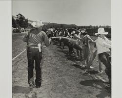 Tug of war on Farmer's Day with bath at the Sonoma County Fair, Santa Rosa, California, 1986