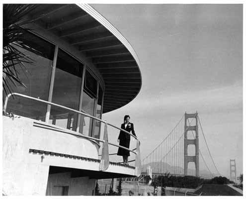 [Mrs. Carl Wilke on balcony of 'The Roundhouse' restaurant near the Golden Gate Bridge]