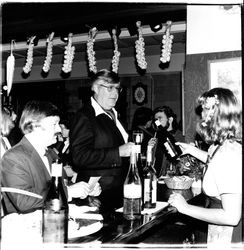Pouring wine at the Sonoma Cheese Factory's 50th anniversary party, Sonoma, California, 1981
