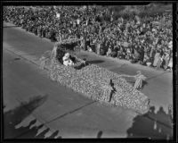 Official in a flower-covered automobile at the Tournament of Roses Parade, Pasadena, 1936