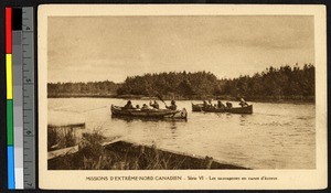 Men paddling canoes down a river, Canada, ca.1920-1940