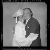 Bob Hope embracing his daughter, Nora after her graduation from Providence High School in Burbank, Calif., 1964