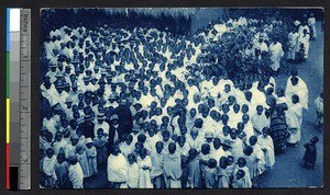 Missionary priest with large congregation, Madagascar, ca.1900-1930