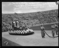 McKinley Junior High School students in costume on float depicting California history, Shriners' parade, Los Angeles Memorial Coliseum, Los Angeles, 1925