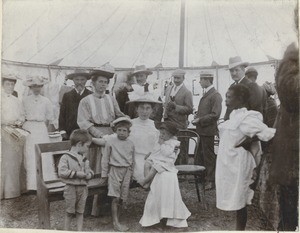 A group of missionaries under a tent