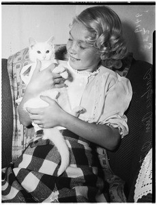 Girl gets cat for the one she lost, 1951