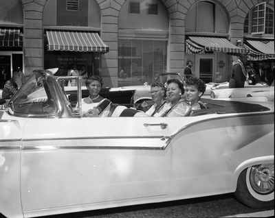 Members of the Order of the Eastern Star riding in convertible
