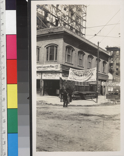 [Street scene showing reconstruction and business signs.]