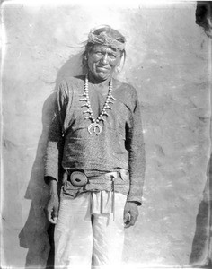 Navajo Indian, "Friendly", wearing solid silver neck ornaments and belt, ca.1900