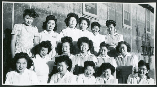 Photograph of the hospital staff aides in front of the Manzanar hospital