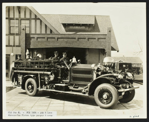 Platoon A poses in fire engine in front of Station No. 4, 4th and Loma