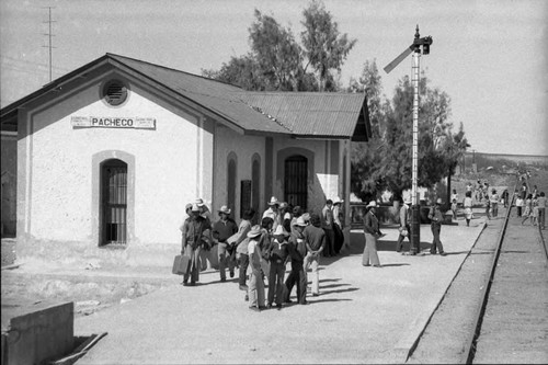 Group of men in cowboy hats at the "Pacheco" train platform, Chihuahua, 1983