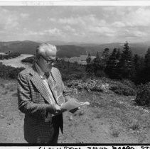 Donald C. McClain, SMUD Director, standing with SMUD's Union Valley Reservoir in the background