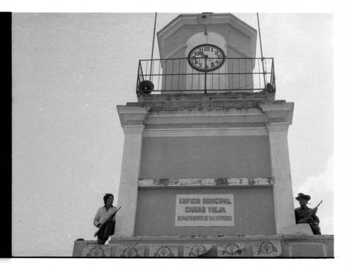 Armed men standing on a clock tower, Guatemala, 1982