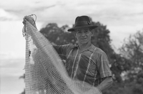 Portrait of Fisherman and his net, La Chamba, Colombia, 1975