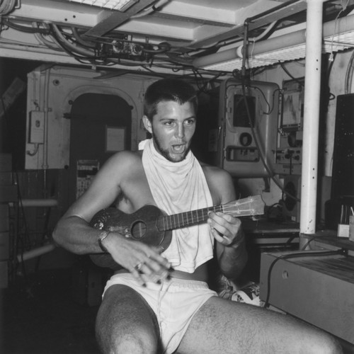 Edward Sheldon Barr plays ukulele aboard R/V Horizon on Leg A of the Capricorn Expedition