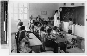 Sr. Ann Elise Gallagher, MM, teaching a primary school class, Baguio, Philippines, 1947