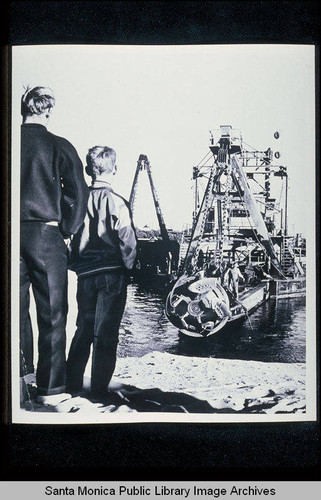 Father and son watching dredging in the Santa Monica Bay (from the Los Angeles Examiner newspaper)
