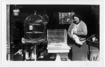 Lucille Riker with cat and birdcage