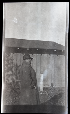 Lucy Hinds standing next to farm building