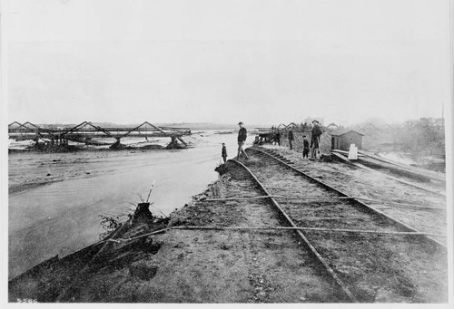 Downey Ave. Bridge (now Broadway) in flood of 1885