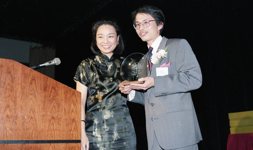 Asian Pacific American Legal Center member presenting an award, Los Angeles, ca. 1989
