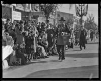 Street vendor selling football related mementos at the Tournament of Roses Parade, Pasadena, 1932