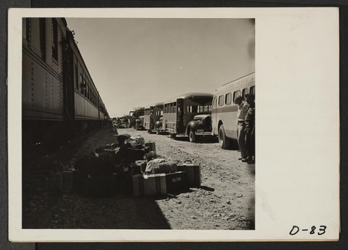 Eden, Idaho--Evacuees from this center at Puyallup, Washington, are transferred to buses from the train and hence to the Minidoka War Relocation Authority center. Photographer: Stewart, Francis Hunt, Idaho